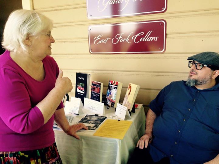 Peggy and Christopher at Gallery 360 Book Fair by Maureen Andrade